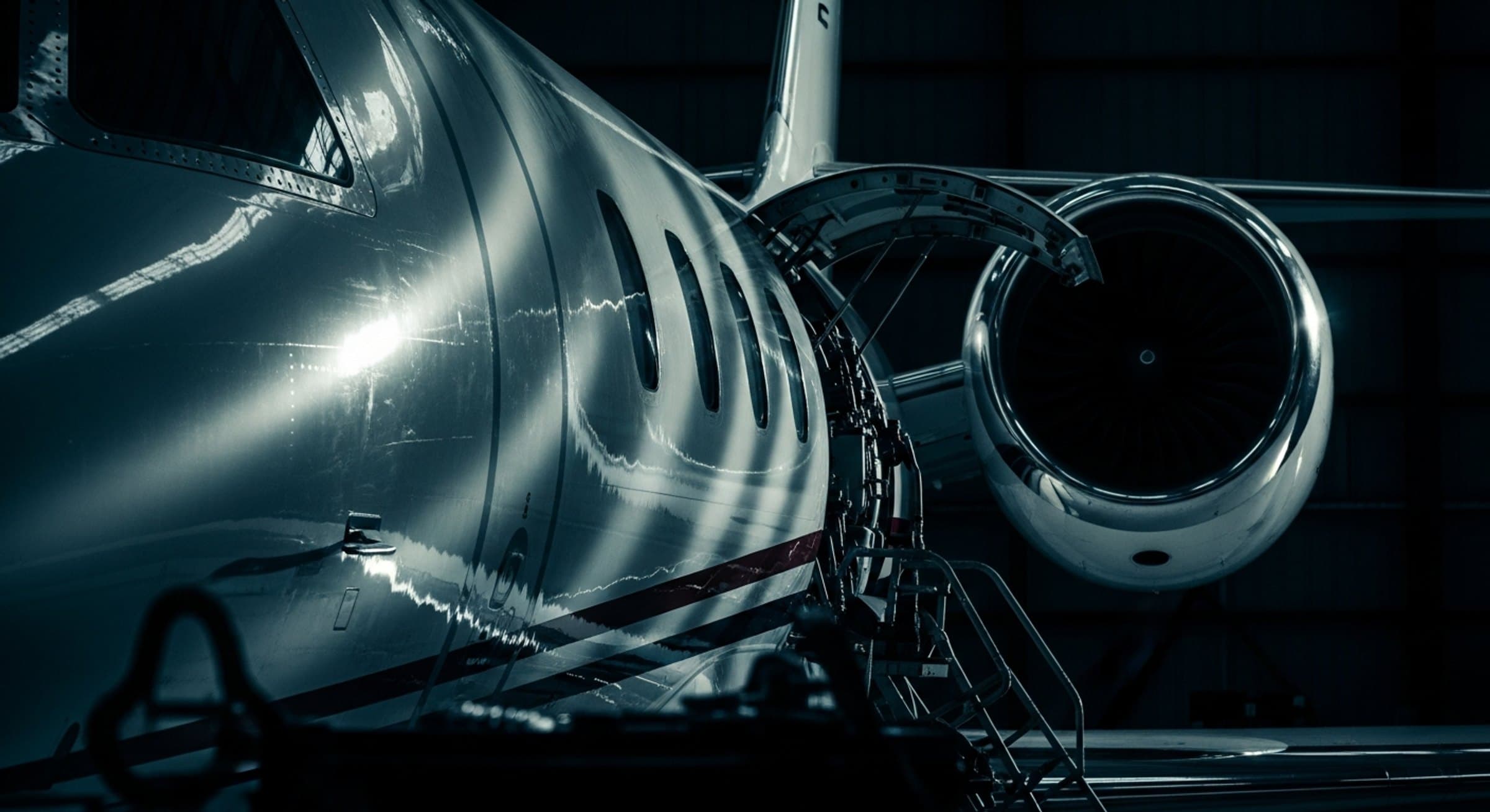 Open engine cowling of a business jet under a work light